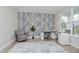 Bright office with a patterned accent wall, desk, chair, and natural light streaming through the windows at 1510 Stonehaven Dr, Westfield, IN 46074
