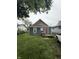 Single-Gathering home featuring a quaint porch and a well-maintained front yard at , Indianapolis, IN 46202