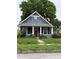 Charming single-Gathering home featuring a quaint porch and a well-maintained front yard at , Indianapolis, IN 46202
