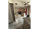 A spacious living room featuring tile floors, ceiling fans, and a cozy seating area at , Indianapolis, IN 46202