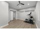 Home gym with exercise equipment, a fan, and modern vinyl floors at 15292 Slateford Rd, Noblesville, IN 46062