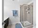 Bathroom featuring shower with glass enclosure, modern vanity, and tile flooring at 15292 Slateford Rd, Noblesville, IN 46062