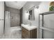 Stylish bathroom with tile shower, modern vanity, and unique hexagon floors at 15292 Slateford Rd, Noblesville, IN 46062