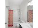 Bathroom with shower and tub combo, plus a vanity and patterned shower curtain at 15292 Slateford Rd, Noblesville, IN 46062