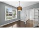 Bright bedroom with wood floors, large window, and a doorway to another room at 15292 Slateford Rd, Noblesville, IN 46062