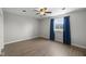 Bright bedroom with a ceiling fan, natural light, and modern vinyl floors at 15292 Slateford Rd, Noblesville, IN 46062