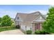 Exterior view of the home's three-car garage and stone and siding accents at 15292 Slateford Rd, Noblesville, IN 46062