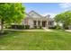 Beautiful home featuring stone accents, dormer windows and professionally landscaped lawn at 15292 Slateford Rd, Noblesville, IN 46062