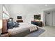 Spacious main bedroom featuring a king bed, mounted tv, and decorative rug at 15292 Slateford Rd, Noblesville, IN 46062