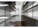 Walk-in closet featuring hardwood floors and custom shelving at 15292 Slateford Rd, Noblesville, IN 46062