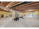 Unfinished basement with exposed ceiling, concrete floor, and insulated walls at 15418 Tattersalls Ln, Fishers, IN 46040