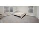 Bedroom with gray carpet, gray walls, two windows with shades, and a white accent crib at 15418 Tattersalls Ln, Fishers, IN 46040