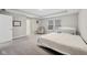 Bedroom featuring gray walls, carpet, a white door, a crib, and windows with shades at 15418 Tattersalls Ln, Fishers, IN 46040