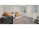 Bedroom with two windows, a crib, and a dresser with décor, creating a cozy and inviting space at 15418 Tattersalls Ln, Fishers, IN 46040