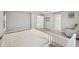 Bedroom with gray walls, carpet, two doors, a crib, and an accent chair at 15418 Tattersalls Ln, Fishers, IN 46040