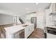 Well-equipped kitchen with a center island, stainless steel appliances, and open access to living areas at 15418 Tattersalls Ln, Fishers, IN 46040