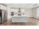 Well-appointed kitchen featuring stainless steel appliances, quartz countertops, and a center island at 15418 Tattersalls Ln, Fishers, IN 46040