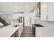 Bright and airy kitchen with a large island, stainless appliances, and seamless integration to the living space at 15418 Tattersalls Ln, Fishers, IN 46040
