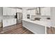 Stylish kitchen with stainless steel appliances, quartz countertops, and white cabinets for a sleek design at 15418 Tattersalls Ln, Fishers, IN 46040