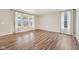 Bright living room with large windows and wood floors at 15418 Tattersalls Ln, Fishers, IN 46040