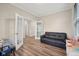 Spacious playroom featuring wood floors, glass paneled doors, and comfortable seating at 15418 Tattersalls Ln, Fishers, IN 46040