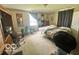 Cozy bedroom with carpet, a double bed, curtains, and ample space for storage and relaxation at 162 N Gladstone Ave, Columbus, IN 47201
