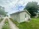 Rear exterior view of home with siding and backyard access at 162 N Gladstone Ave, Columbus, IN 47201