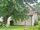 Exterior view of home, showing the side of the house with large tree and siding at 162 N Gladstone Ave, Columbus, IN 47201