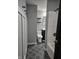 Well-lit bathroom with a shower/tub combo, modern vanity, and stylish gray tile flooring at 179 E Pearl St, Greenwood, IN 46143