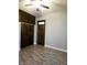 Bedroom with built-in storage, wood-look floors, and neutral walls at 179 E Pearl St, Greenwood, IN 46143