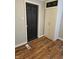 Bedroom featuring wood floors, built-in shelves, and a closet at 179 E Pearl St, Greenwood, IN 46143