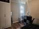 Bedroom featuring a desk, modern storage, and natural light from the window at 179 E Pearl St, Greenwood, IN 46143
