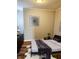 Comfortable bedroom featuring wood floors, dark decor, and ample natural light at 179 E Pearl St, Greenwood, IN 46143