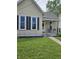 Inviting single-story home with a covered front porch, neat lawn, and sidewalk entry at 179 E Pearl St, Greenwood, IN 46143
