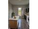 Kitchen featuring an island with light countertops, cabinets, and modern stainless steel appliances at 179 E Pearl St, Greenwood, IN 46143