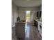 Spacious kitchen area features an island, wood-style flooring, and modern appliances at 179 E Pearl St, Greenwood, IN 46143