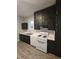 This kitchen features stainless steel appliances, dark cabinetry, and stylish countertops at 179 E Pearl St, Greenwood, IN 46143