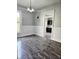 Open-concept space with wainscoting and wood-look floors at 179 E Pearl St, Greenwood, IN 46143
