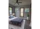 Bedroom features a comfortable bed, artwork, natural lighting, and stylish decor at 179 E Pearl St, Greenwood, IN 46143