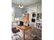 Home office space with desk, chairs, bookshelves and accent wall at 179 E Pearl St, Greenwood, IN 46143