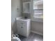 Cozy bathroom with a single sink vanity, mirror, and a window for natural light at 1820 S M St, Elwood, IN 46036