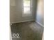 Cozy bedroom with carpet and a window at 1820 S M St, Elwood, IN 46036