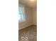 Bedroom featuring plush carpeting, neutral wall color, and a bright window at 1820 S M St, Elwood, IN 46036