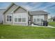 Spacious backyard featuring a well-manicured lawn, outdoor patio with grill and furniture for enjoyable outdoor living at 19144 Goins Blvd, Westfield, IN 46074