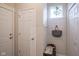 Welcoming entryway with a shoe rack, coat hooks, a decorative bag, and natural light from a small window at 19144 Goins Blvd, Westfield, IN 46074