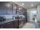 Kitchen with dark cabinets and stainless steel appliances at 19144 Goins Blvd, Westfield, IN 46074