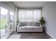Cozy sunroom featuring a comfortable sofa, sheer curtains, and sliding glass door leading to a patio at 19144 Goins Blvd, Westfield, IN 46074