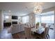 Bright, open-concept living area with hardwood floors, a fireplace, comfortable seating and plenty of natural light at 19144 Goins Blvd, Westfield, IN 46074