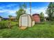 Fenced in backyard featuring a storage shed, well kept lawn and mature trees at 200 Forum Dr, Whiteland, IN 46184