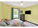 bedroom with wood-look floors, sprinkles wall decor, and a colorful plush bed at 200 Forum Dr, Whiteland, IN 46184